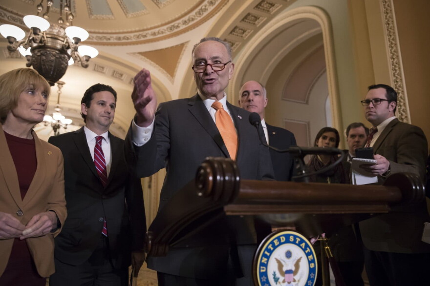 Senate Minority Leader Chuck Schumer, D-N.Y., joined by, from left, Sen. Maggie Hassan, D-N.H., Sen. Brian Schatz, D-Hawaii, and Sen. Bob Casey, D-Pa., meets with reporters as work continues on a plan to keep the government open as a funding deadline approaches, at the Capitol in Washington, Tuesday, Feb. 6, 2018. (J. Scott Applewhite/AP)