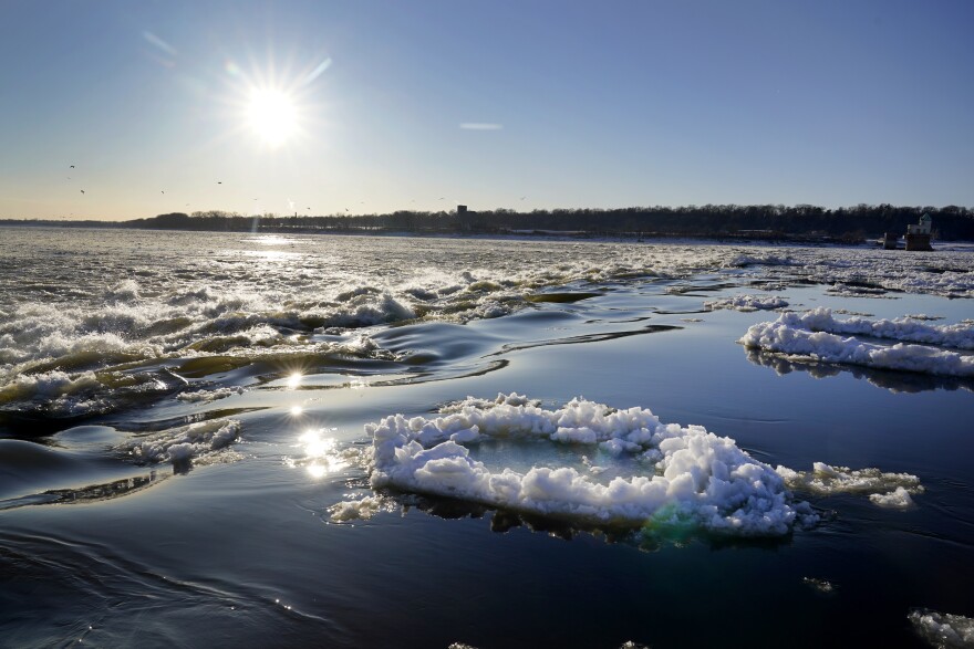 Ice flows along a frozen Mississippi River near Chain of Rocks Bridge Tuesday, Feb. 16, 2021, in Madison County, Ill. The region has been plunged into the deep freeze with brutally cold temperatures and more snow in the forecast. (AP Photo/Jeff Roberson)