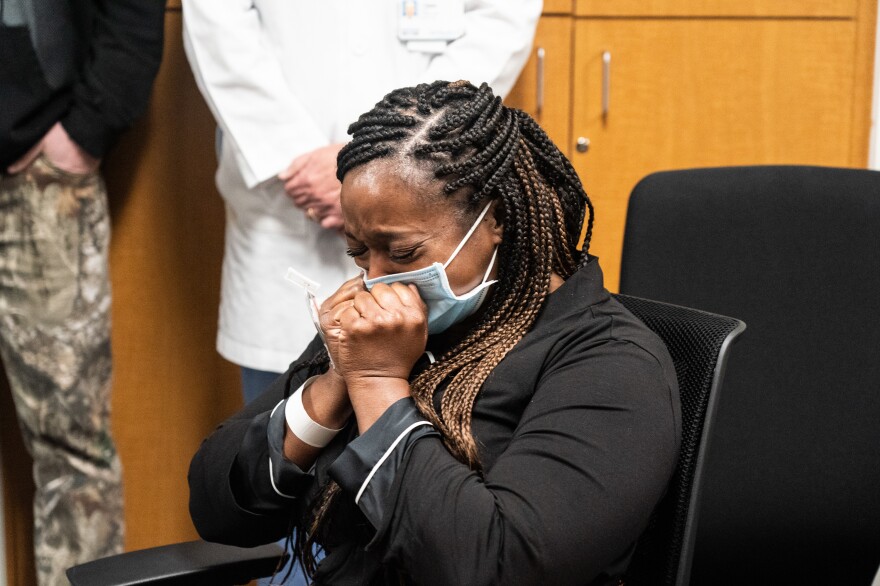 Kidney donor Lisa Jolivet reacts as she receives news that the kidney transplant surgery on her mother was successful.