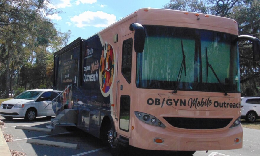 UF Health’s OB/GYN Mobile Outreach unit is seen parked during the Womb to World community event in Alachua County on Saturday, Feb. 21, 2026. The mobile clinic offered ultrasounds and prenatal services. (Annaleis Holz/WUFT)