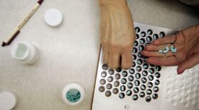 A pharmacy technician fills out a prescription of Levoxyl at Rosemont Pharmacy in January 2006 in Portland, Maine. The future of "essential health benefits" like maternity benefits, prescription drugs, preventive services and chronic disease management is uncertain with the Affordable Care Act under fire. (Joe Raedle/Getty Images)