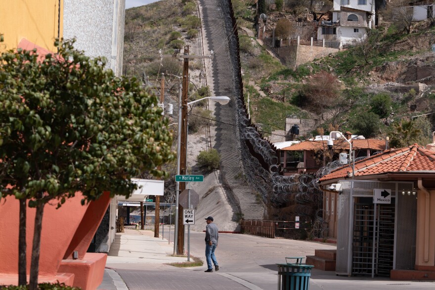 A man walks by downtown Nogales in Arizona, across the border from Mexico.