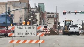 A road closed sign blocks traffic at the intersection of Main Street and Jackson Boulevard in downtown Elkhart, where construction is underway on a sewer project.