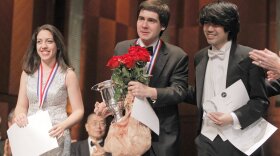 Cliburn medalists Beatrice Rana, second place winner; Vadym Kholodenko, first place winner; and Sean Chen, third place winner, receive applause from the audience at the final awards ceremony at the 14th Van Cliburn International Piano Competition on Sunday.