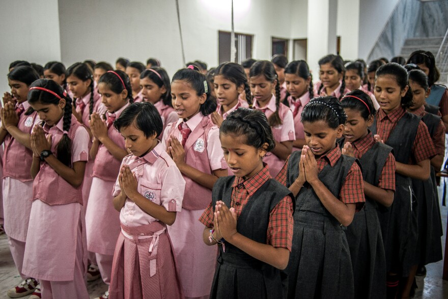 Girls start the day with a prayer at the Veerni Institute in Jodhpur, India. It's a boarding school where nearly half the students are child brides.