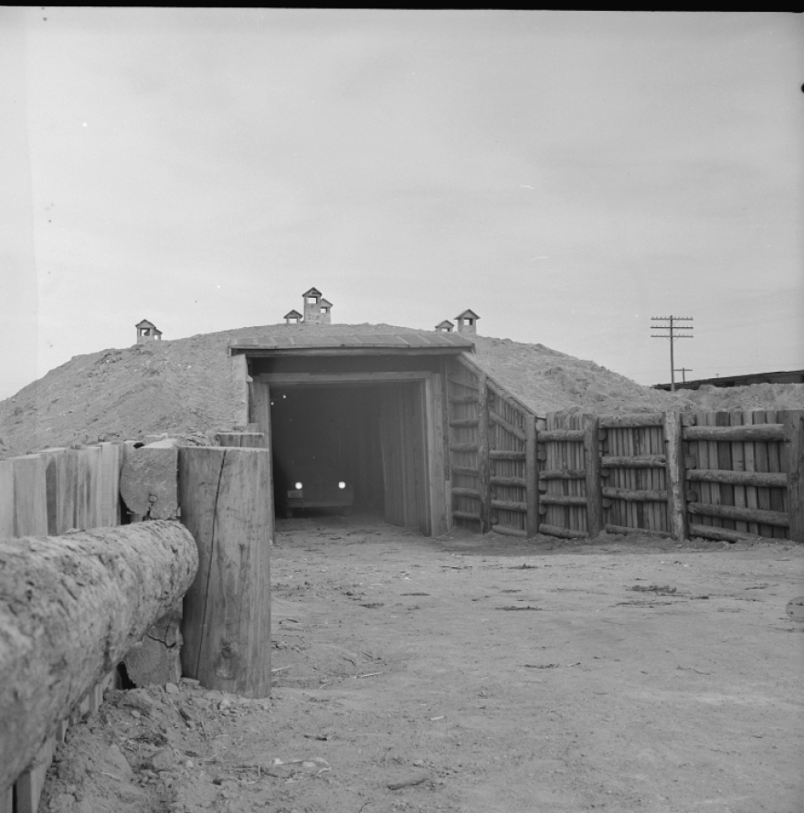 A truck driving out of a root cellar used to store produce at an a Japanese-American incarcaration site 