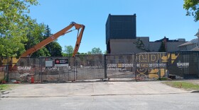Construction vehicle at a construction site for demolition of Royal George Theatre