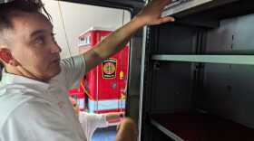 Suffolk Fire & Rescue's Battalion Chief Keith Johnson demonstrates where new on-truck vaults for medications will be installed on Friday, June 14, 2024.