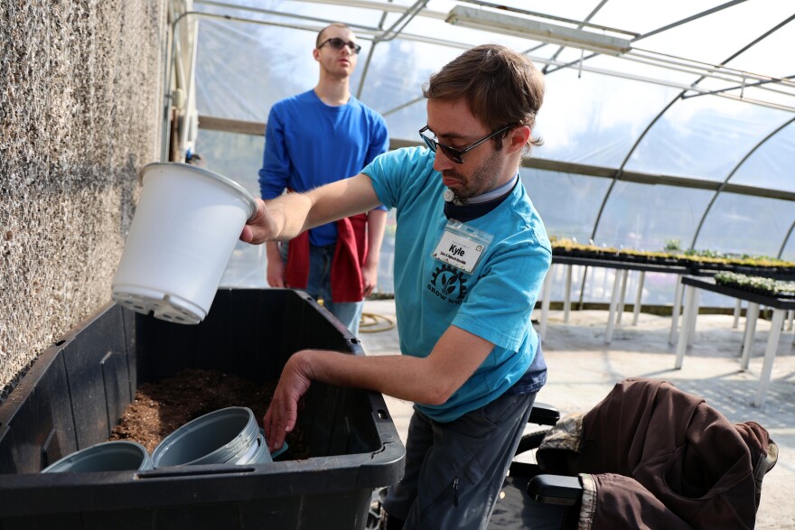 Kyle Smith (right) and Michael Sayeski (left) fill pots with soil at Grow Hub in Gainesville, Fla., Tuesday, Jan. 28, 2025. (Ashleigh Lucas/WUFT News)