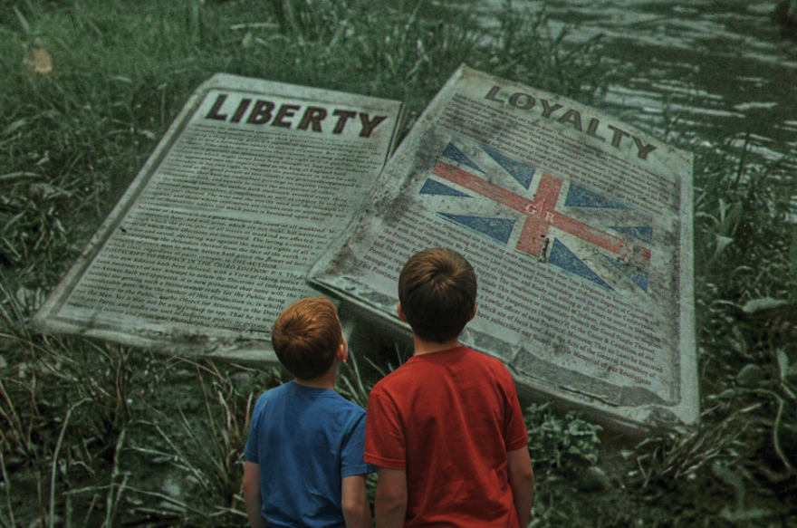 Young men choose which side they would have fought on at the Carolina Rising Museum in