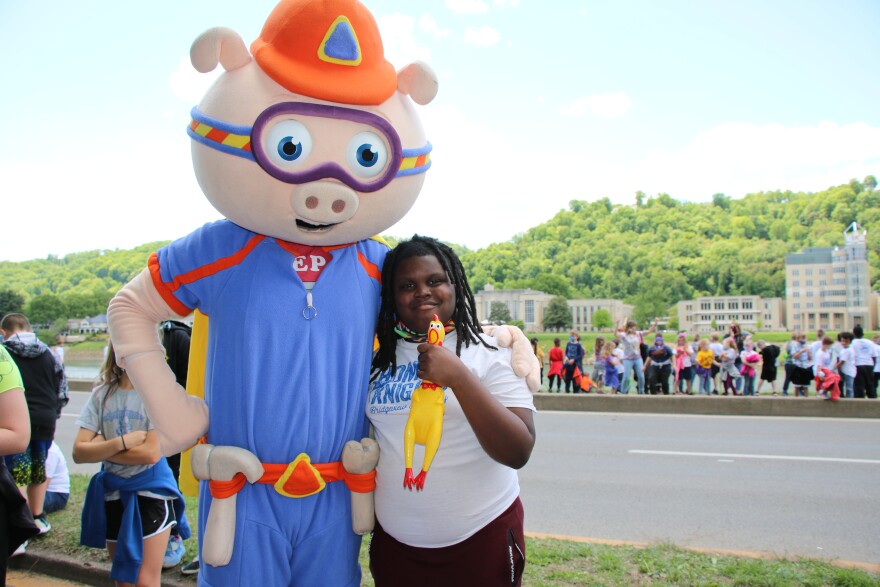  Alpha Pig is joined by one of the winners of the Chicken Dance. She was best in her grade level.