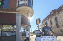 Dominic Vittone of Janesville holds a sign decrying Republican cuts to health care on the sidewalk outside the Rock County Democrats’ office in downtown Janesville from September of this year. Early voter data suggests southern Wisconsin could be a battleground area in deciding many races in the state. Midterm Election day is Tuesday, November 3.