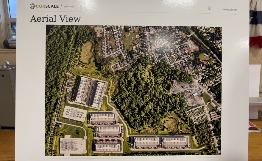 The posters featured renderings of what the campus could look like once built compared to the nearby neighborhood.