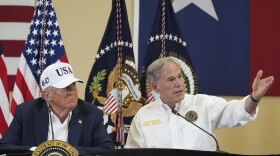 Texas Gov. Greg Abbott speaks as President Donald Trump listens during a roundtable discussion with first responders and local officials at Hill Country Youth Event Center in Kerrville, Texas, during a tour to observe flood damage, Friday, July 11, 2025.