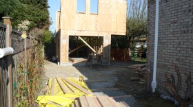 Jim Loter documented building a backyard cottage in Seattle. Here's a picture from day 25: erecting the walls.