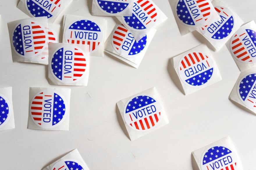 "I Voted" stickers spread out on a white surface