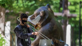 An Interlochen Arts Academy student practices outside Corson Auditorium