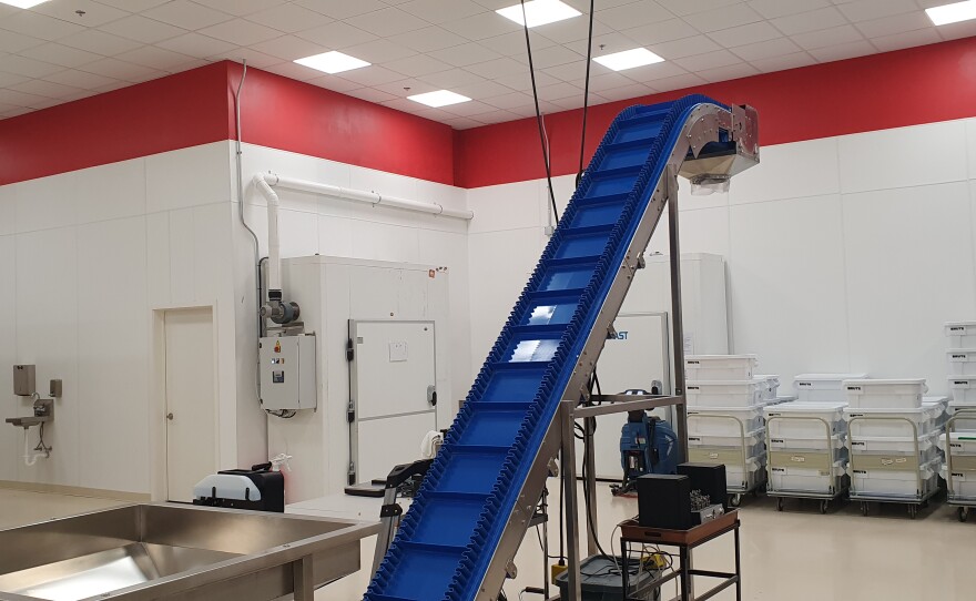 This device loads the finished pasta into packaging.