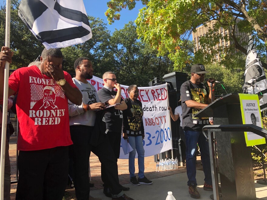 Edward Moore wipes his eyes while Rodrick Reed, brother of death row inmate Rodney Reed, rallies supporters outside the Texas governor's mansion in Austin Nov. 9, 2019.