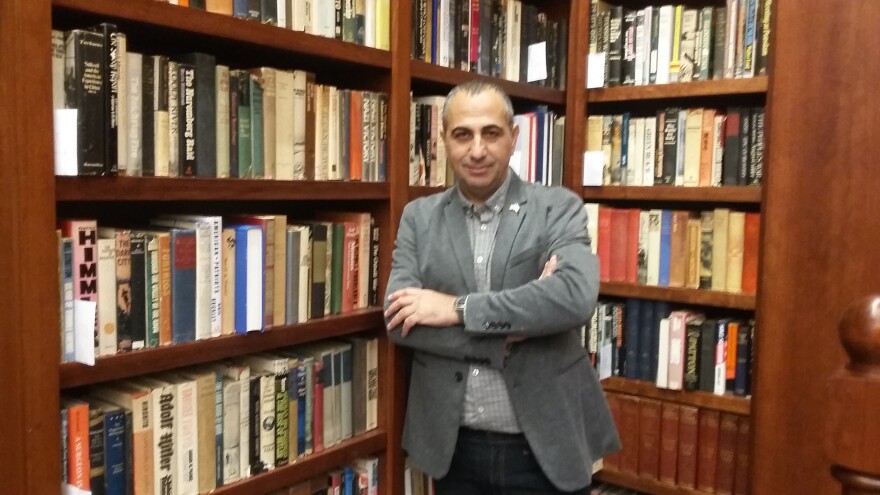 Former Mossad agent Avner Avrahman curated exhibit on holocaust mastermind Adolf Eichmann. Avrahman is seen in the new library at the National World War II Museum