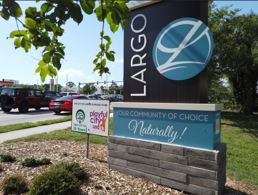 Largo sign with cars driving past it 