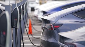 A long line of 2020 models charge outside a Tesla dealership in Littleton, Colo. (David Zalubowski/AP Photo)