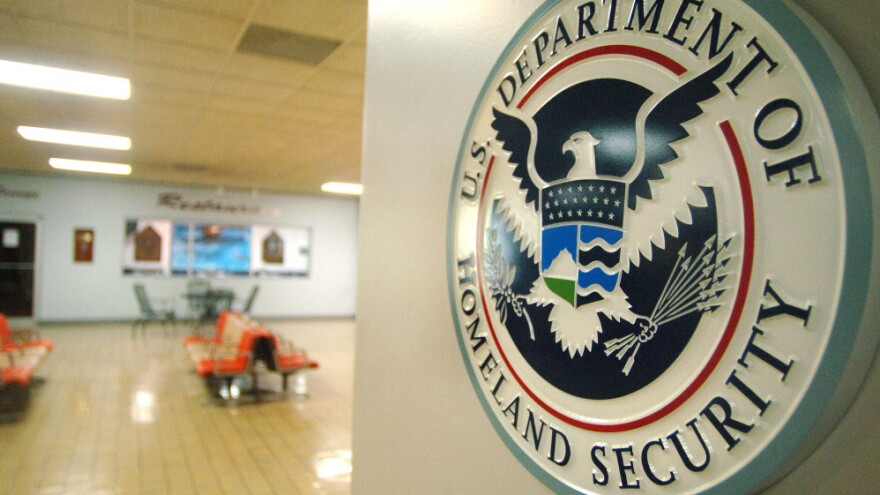 A U.S. Department of Homeland Security sign hangs in an empty terminal at the Tri-State Airport in Ceredo, W.Va.