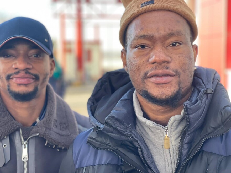 Francis Chokura (right) and his brother crossed in Hungary from Ukraine. Chokura said he received shelter and warm clothes from the Ukrainian government and was not bothered by Ukrainians getting priority on trains leaving the country.