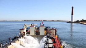 The Shallow Draft Dredge MURDEN clears shoaling from Barnegat Inlet, N.J. in April of 2014.