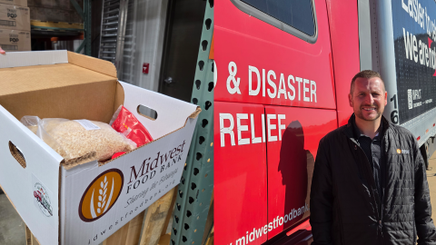 Midwest Food Bank Morton Executive Director John Cirilli and one of the charity's relief packages