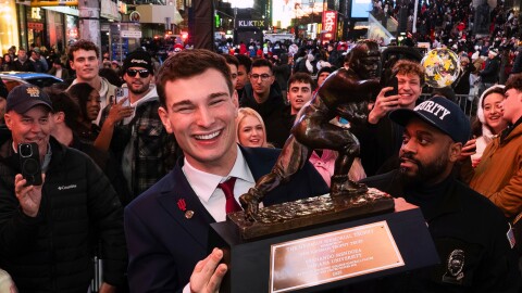 Indiana NCAA college football quarterback Fernando Mendoza celebrates in Times Square after winning the Heisman Trophy in New York, Saturday, Dec. 13, 2025.