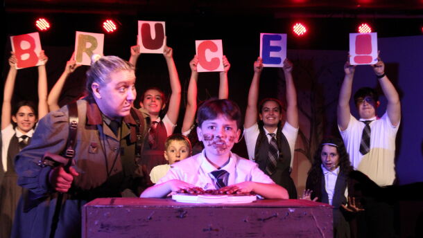 Allison Lund as Headmistress Trunchbull and Frankie Savage as Bruce in chocolate cake scene from 'Matilda."
