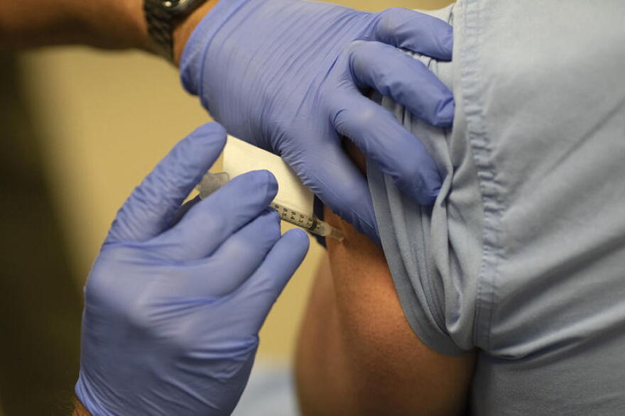 COVID-19 vaccines by Pfizer-BioNTech are administered at the IU Health Neuroscience Building Wednesday, Dec. 16.
