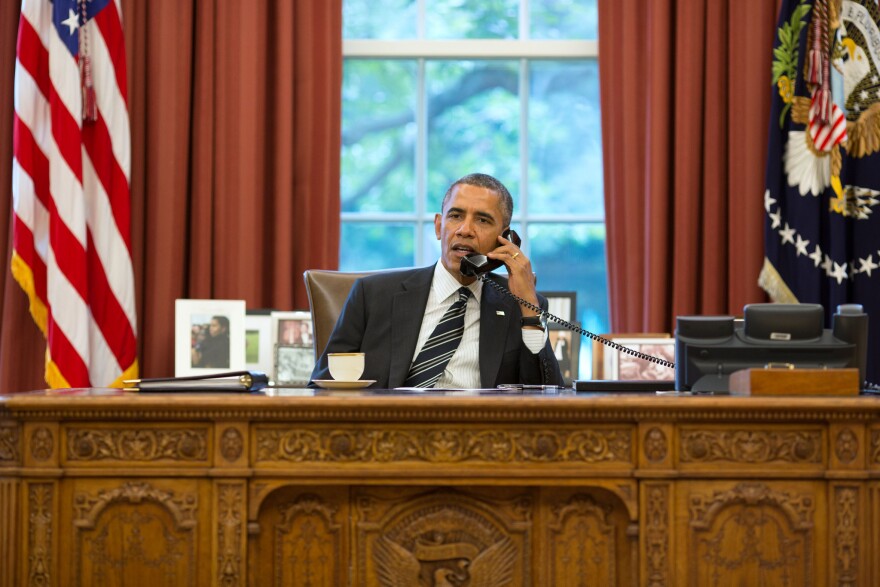 President Obama talks with President Hassan Rouhani of Iran during a phone call in the Oval Office, Sept. 27, 2013.