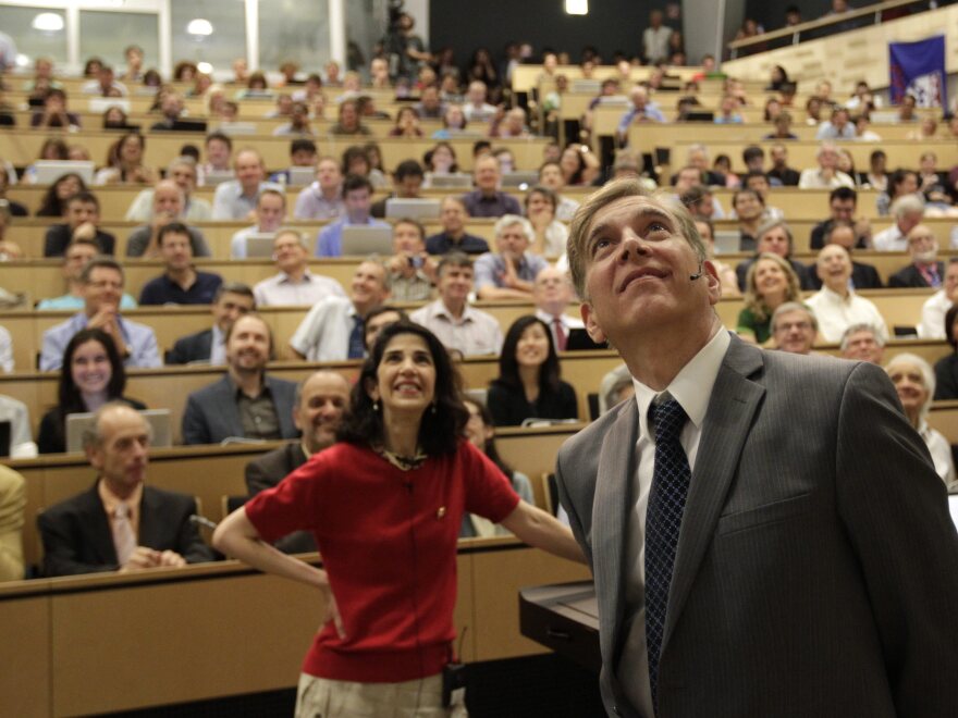 Fabiola Gianotti of the ATLAS group (left) and Joe Incandela of the Compact Muon Spectrometer team announced their findings during a presentation Wednesday in Switzerland.
