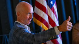 Republican gubernatorial candidate Mike Minogue gives a thumbs up during his introduction at the Cape Cod Republican Women's Luncheon at the Yarmouth House Restaurant in April. (Jesse Costa/WBUR)