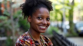 In this April 16, 2012 file photo, Pulitzer Prize winning poet Tracy K. Smith poses outside her apartment in New York. Smith has embarked on the first of several trips to bring her poetry to rural pockets of the country where she says book festivals rarely take her. (Jason DeCrow, File/AP)