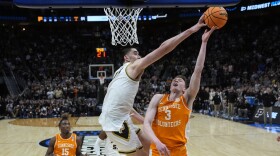 Purdue center Zach Edey (15) blocks a basket attempt by Tennessee guard Dalton Knecht (3) during the second half of an Elite Eight college basketball game in the NCAA Tournament, Sunday, March 31, 2024, in Detroit. (AP Photo/Paul Sancya)