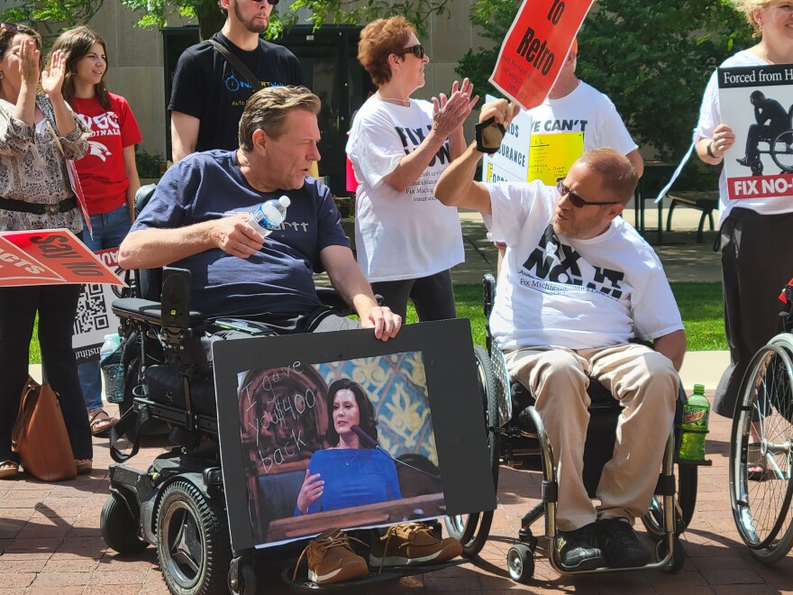 People catastrophically injured in car crashes protest in Lansing over a 2019 law that is driving some of their care providers out of business.