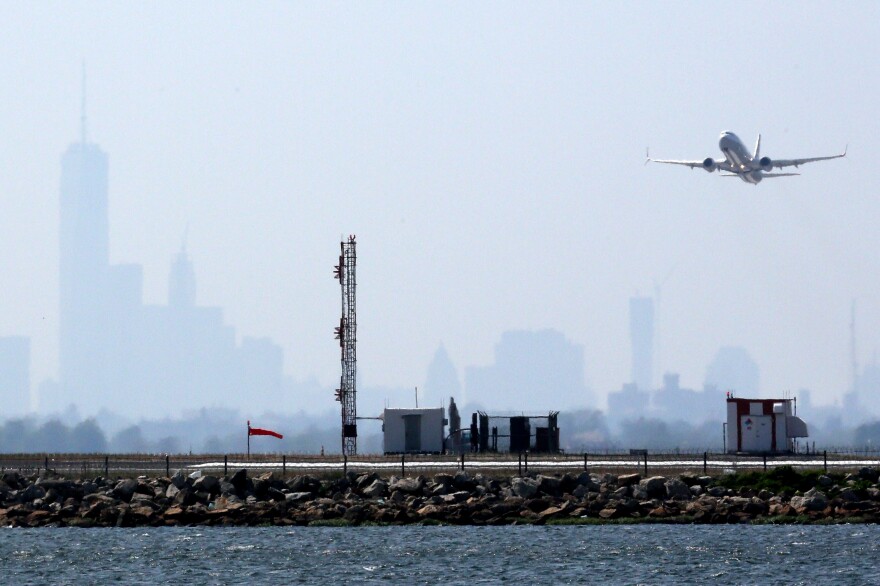 A plane takes off from New York's John F. Kennedy International Airport on May 25. Airports want Congress to raise passenger fees to pay for improvements.