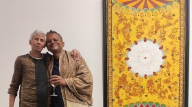 Benigna Chilla and Sandip with her artwork Birds and Flowers for Reba at Nature Morte Gallery, New Delhi