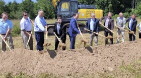 Officials stage a ceremonial groundbreaking for the expansion of Oswego County's industrial park in Phoenix.