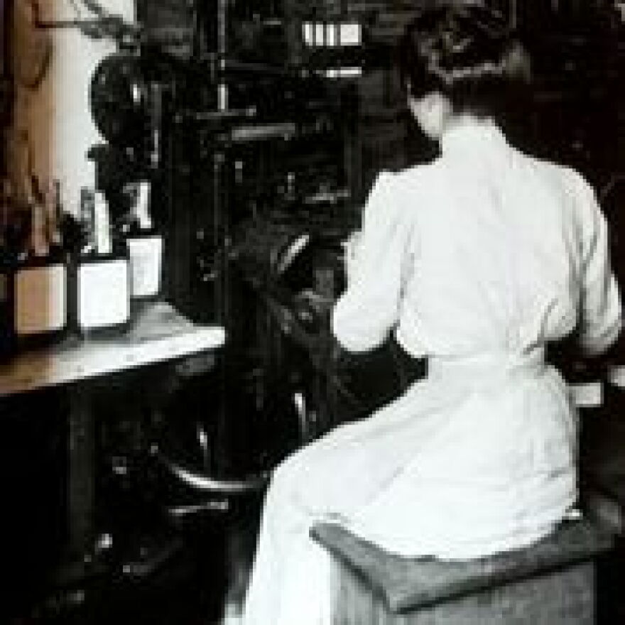 A woman places labels on Old Crow bourbon bottles sometime in the early 1900s.