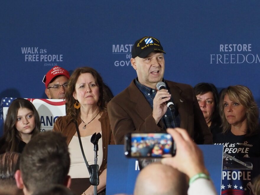 State Sen. Doug Mastriano addresses supporters from a stage at his gubernatorial campaign's election night headquarters in Camp Hill on Nov. 8, 2022.
