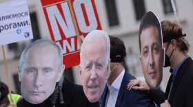 Protesters dressed as Russian President Vladimir Putin (L), U.S. President Joe Biden (C) and Ukrainian President Volodymyr Zelensky attend a small rally to demand a diplomatic solution to the current threat of war in Ukraine in Berlin, Germany.