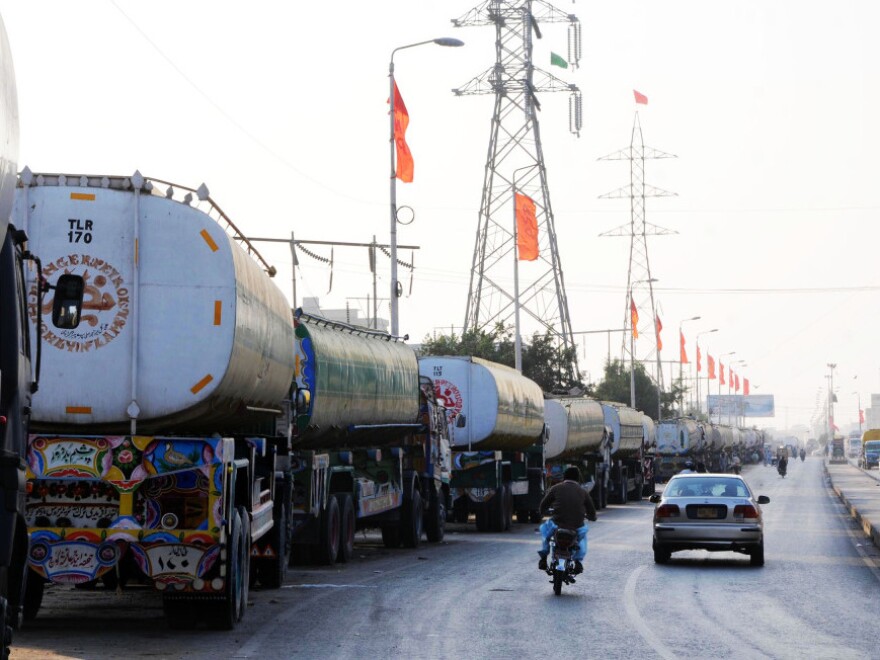 Oil tankers line the road near a NATO supply terminal in Karachi, on Feb. 9, 2012. Analysts say Pakistan is in no hurry to reopen the supply routes to Afghanistan, though truckers complain that they can't earn any money. 