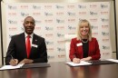 Don Hunt of NC State and Stacy Waters-Bailey of South Piedmont Community College sign the agreement to formalize the Wolfpack Connect program at South Piedmont.