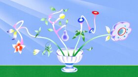 An illustration of a short, large-mouthed vase placed on an implied surface. Placed inside the vase are four plant-like stems that spell out “Reno,” which are adorned with flowers, leaves, fruits and more.