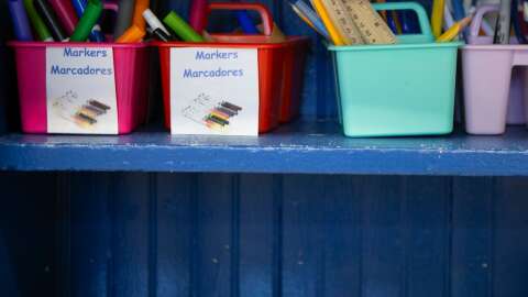 Plastic containers hold school supplies