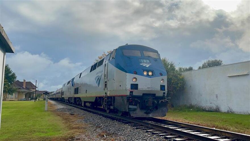 An Amtrak train pulling out of a station.